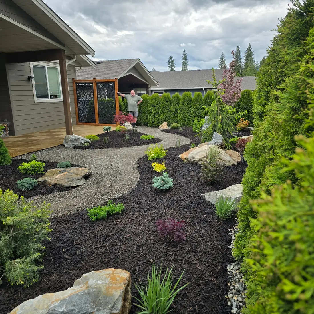 Backyard rock garden with feature boulders and gravel path, Salmon Arm BC