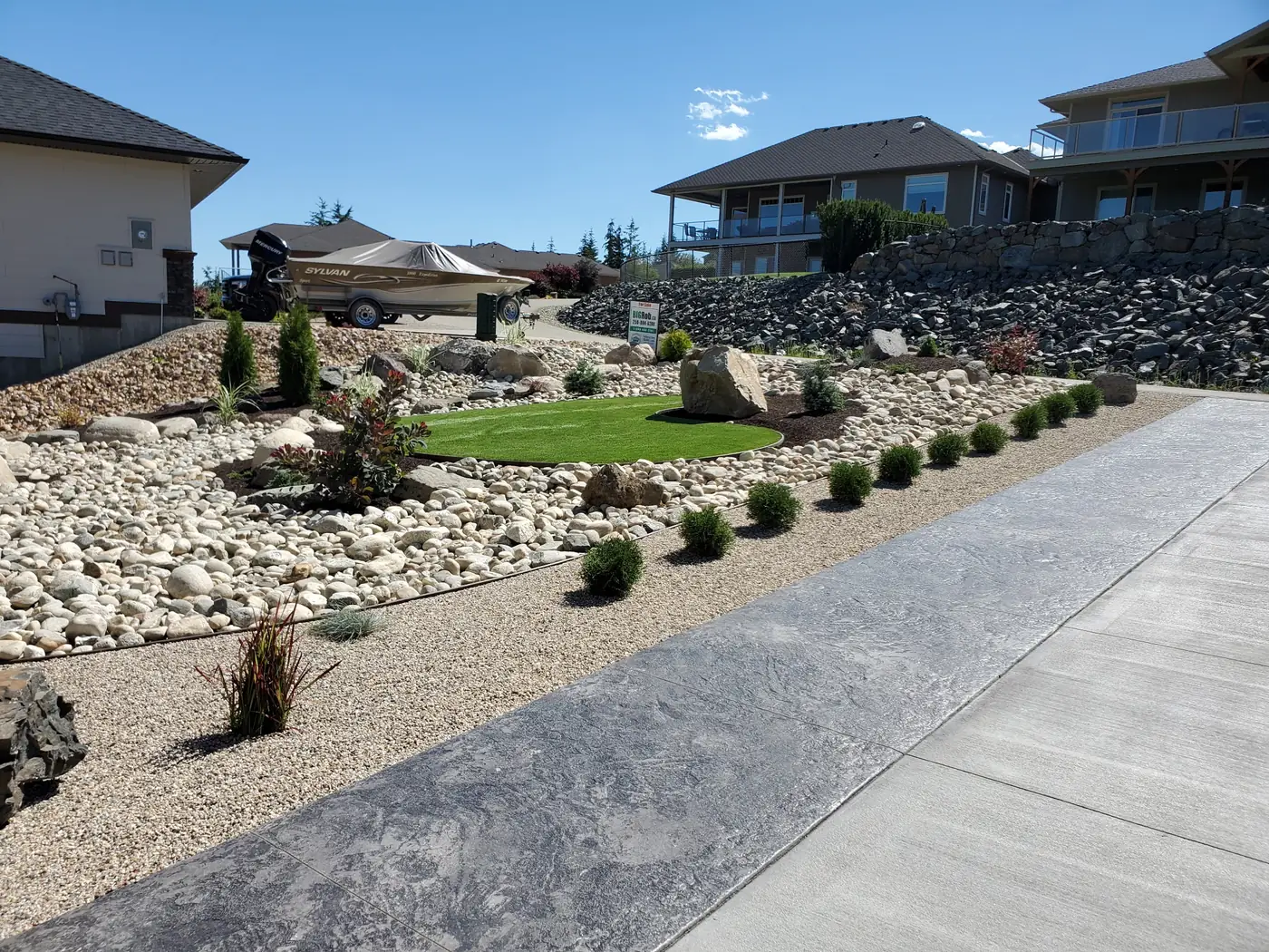 River rock front yard, boulders and lawn with mountain views, Salmon Arm BC